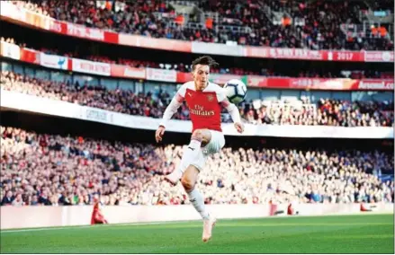  ?? ADRIAN DENNIS/AFP ?? Arsenal midfielder Mesut Ozil controls the ball during the English Premier League football match between Arsenal and Everton at the Emirates Stadium in London on Sunday.