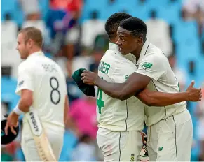  ?? AP ?? South Africa’s Vernon Philander, left, and Kagiso Rabada celebrate the winning wicket of Stuart Broad on their way to a first test win over England in Pretoria.