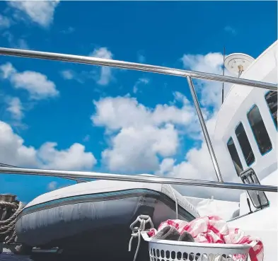  ??  ?? CLEAN BREAK: Boat owner and Marlin Marina resident Brenda Kay made the most of sunny, windy