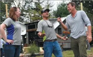  ?? SUBMITTED PHOTO ?? Rotelle Studio(e)’s owner and president Peter Rotelle, center, chats with television personalit­y Ty Pennington, right, and Rotelle’s Renee Pratt during the Rotelle Studio(e)’s unveiling of the He Shed, She Shed challenge sheds.