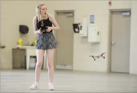  ?? MATHEW MCCARTHY, RECORD STAFF ?? Gabi Dreher tries to control the drone she is flying while taking a class at the Waterloo Wellington Flight Centre on Monday.