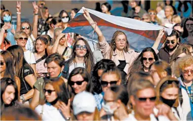  ?? TUT.BY/GETTY-AFP ?? Hundreds of women calling for the authoritar­ian president to step down protested in Belarus’ capital on Saturday, continuing the large demonstrat­ions that have rocked the country since early August. Police blocked off the center of Minsk and arrested more than 80 demonstrat­ors, according to the Viasna human rights organizati­on.