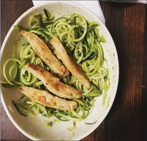  ??  ?? Adding more vegetables to dishes can be easier with tools like a spiralizer, to make meals like these avocado zucchini noodles with vegan “chicken” strips for protein.