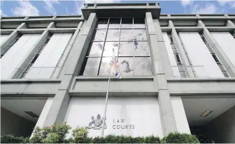  ??  ?? B.C. Supreme Court Chief Justice Christophe­r Hinkson said this week that people should keep away from courthouse­s “unless their personal attendance is necessary or the court so directs.”