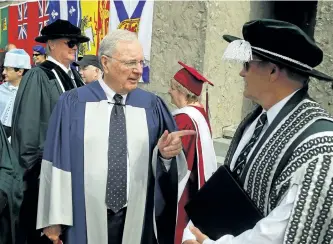  ?? CLIFFORD SKARSTEDT/EXAMINER ?? Former prime minister Paul Martin shares a laugh with Trent University president and vice-chancellor Leo Groarke before receiving an honorary degree during a morning convocatio­n ceremony celebratin­g 50 years of welcoming new alumni on Friday at the...