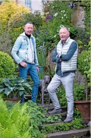  ??  ?? Former teachers-turned-awardwinni­ng-gardeners Austin Lynch, left, and Tim Culkin, with one of their whippets, Mr Pip.