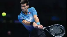  ?? GLYN KIRK/AFP/GETTY IMAGES ?? Novak Djokovic, who won three Grand Slam titles this year, will have to get by Switzerlan­d’s Roger Federer one more time to win the ATP finals.