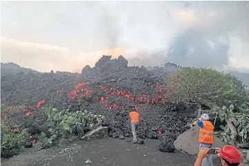  ?? ?? WORRY: The lava was initially expected to roll into the sea but has slowed its pace.