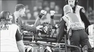  ?? Michael Ainsworth Associated Press ?? SEATTLE receiver Ricardo Lockette gestures while being taken off on a stretcher. He was motionless for several moments after being hit by Dallas’ Jeff Heath while covering a punt.