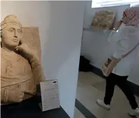  ?? AFP ?? A woman tours the national antiquitie­s museum in the Syrian capital Damascus on Sunday. —