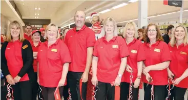  ??  ?? Having been part of the Coles Warragul team for thirty plus years, from left: Julie Bachelor, Di Molloy, Daniel Voumard, Bron Meggetto, Sharon Hughes, Sue O’Neil and Leanne Notman cut the ribbon to unveil the refurbishe­d store.