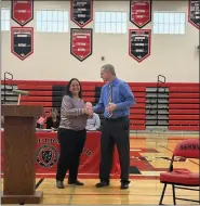  ?? SUBMITTED ?? Brookside High School student council leader Tandi Fritz, left, inducts Brookside alum Steven Garton into the Sheffield-Sheffield Lake City Schools Gallery of Success.