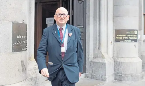  ??  ?? ACCUSED: Alan Donnelly, seen leaving Aberdeen Sheriff Court, is accused of touching a man against his will at a function in the city