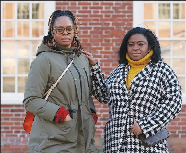  ?? MICHAEL DWYER / ASSOCIATED PRESS ?? Charity Wallace, left, and Chassity Coston pose Feb. 24 in Harvard Yard at Harvard University in Cambridge, Mass. Wallace, 37, is a biotech profession­al, and Coston, 35, is a middle-school principal. With attacks on diversity, equity and inclusion initiative­s raging on, Black women looking to climb the work ladder are seeing a landscape that looks more hostile than ever.