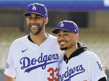  ?? AP ?? David Price (l.) and Mookie Betts join a 2020 Dodger team that was already great.