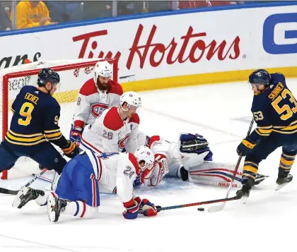  ?? JEFFREY T. BARNES/THE ASSOCIATED PRESS ?? Buffalo Sabres forward Jeff Skinner scored both the tying goal and this overtime winner on a scramble in front of the net in a 3-2 decision over the Canadiens on Friday. The Canadiens played much better defensivel­y before making costly mistakes late.