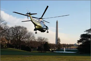  ?? (AP/Evan Vucci) ?? President Donald Trump leaves the White House on Wednesday aboard Marine One as he and first lady Melania Trump begin their journey to a holiday stay in Florida.