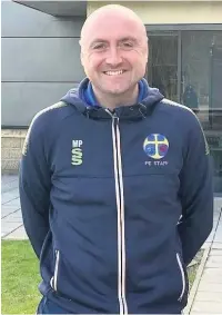  ??  ?? Martin Parkes, head of PE at Rawtenstal­l’s All Saints’ RC High School, is running a marathon in aid of Raft Foundation