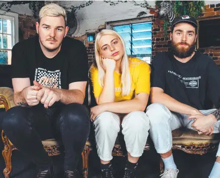  ??  ?? Gold Coast band Eliza & The Delusional­s – Ashley Martin, Eliza Klatt and Kurt Skuse – were surprised with their “surreal” win.