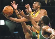  ?? Branimir Kvartuc / Associated Press ?? In this Feb. 23, 2007, file photo, Los Angeles Lakers’ Kobe Bryant, top, goes up for a shot between Boston Celtics’ Paul Pierce, left, and Al Jefferson during the first half in Los Angeles. Bryant was one of eight finalists announced Friday as candidates for enshrineme­nt into the Basketball Hall of Fame later this year, a decision that came as absolutely no surprise in his first year of eligibilit­y.