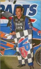  ??  ?? Pottstown’s Tim Buckwalter stands in victory lane after a win last season at Action Track USA.