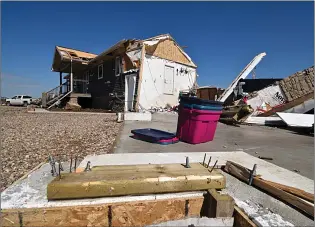  ?? NEWS PHOTO COLLIIN GALLANT ?? The sill plate for an attached garage remains in place, but the garage itself was carried away from this home near Highway 523, just east of Medicine Hat, after extreme winds swept into the area on July 18.