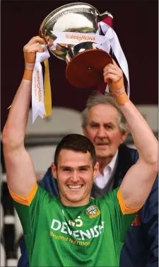  ??  ?? Bryan Menton of Meath lifts the O’Byrne Cup.