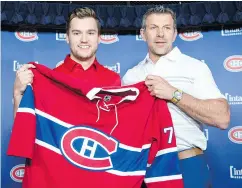  ?? RYAN REMIORZ / THE CANADIAN PRESS FILES ?? Jonathan Drouin, with GM Marc Bergevin, was acquired from the Tampa Bay Lightning.