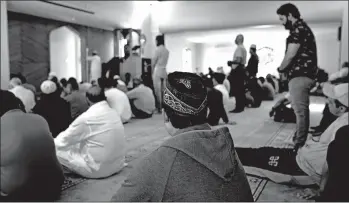  ?? MARK BAKER/AP ?? Muslims attend Friday prayers Feb. 28 at the Al Noor mosque, site of the first attack, in Christchur­ch, New Zealand.