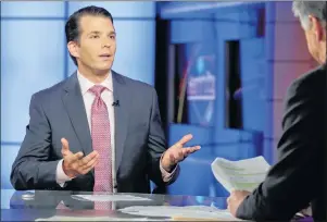  ?? AP PHOTO ?? Donald Trump Jr., left, is interviewe­d by host Sean Hannity on his Fox News Channel television program, in New York Tuesday.