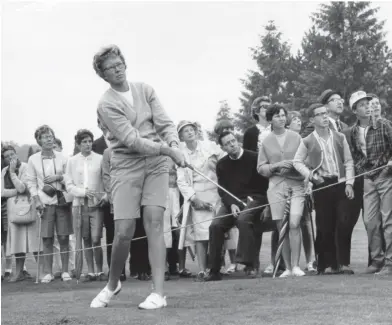  ?? ASSOCIATED PRESS ?? In this 1967 file photo, the gallery follows Mickey Wright’s iron shot from the fairway at the Toronto Golf Club. Hall of Fame golfer Wright, who won 82 LPGA tournament­s including 13 majors, died Monday, Feb. 17, 2020, of a heart attack, her attorney said. Wright was 85.