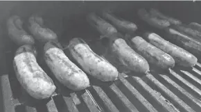  ?? PHOTOS: DANIEL HIGGINS/USA TODAY ?? Keep the grill temperatur­e around 300 degrees and turn brats every few minutes to prevent splitting and maximize browning.