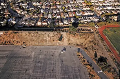  ?? Photos by Jessica Christian / The Chronicle ?? The Balboa Reservoir site is currently used as City College of San Francisco's student parking. According to the city, planning is under way to develop the site with mixed-income housing, open space and community amenities.