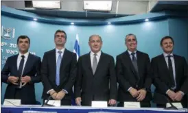  ?? OLIVIER FITOUSSI — THE ASSOCIATED PRESS ?? Co-founder and CTO of Mobileye Prof. Amnon Shashua, left, Israeli Economy Minister Eli Cohen, Israeli Prime Minister Benjamin Netanyahu, Intel CEO Brian Krzanich and the co-founder and CTO of Mobileye, Ziv Aviram, attend a press conference at the Prime Minister’s Office in Jerusalem.