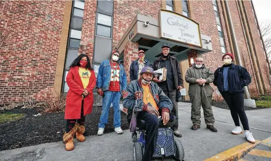  ?? Photos by Earl Richardson / Contributo­r ?? Residents of Gabriel Tower organized with the help of advocates from KC Tenants. In front is Rick Loker, a resident of the apartments for the past two years. Back row, from left: Tiana Caldwell of KC Tenants; residents Trent Tyler, Jack Sisson, Ronald McMillan and Donnie DeBarge; and Wilson Vance of KC Tenants.