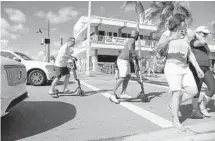  ?? AMY BETH BENNETT/SUN SENTINEL ?? Fort Lauderdale's controvers­ial new scooter rental program has some saying the electric vehicles are hazards and a menace while others say they're a great idea.