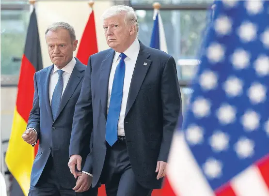  ?? REUTERS ?? US President Donald Trump walks with the President of the European Council Donald Tusk, left, in Brussels, Belgium yesterday.