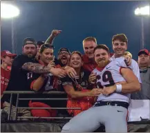  ?? KEN WARD / For the Calhoun Times ?? Georgia’s Trent Frix (69) celebrates with family and friends after the Bulldogs’ 42-7 win over Florida last Saturday in Jacksonvil­le.