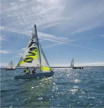  ?? STEPHANIE GRAY ?? Iron Duke Sea Scouts Malachi Beekmeyer, left, and Theo Gill racing in an RS Feva sailboat on Easter Sunday.