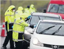  ?? PHOTO: GETTY IMAGES ?? Precaution­s . . . Police check on motorists travelling to and from Auckland at a checkpoint north of the city on State Highway 1 at Brynderwyn yesterday.