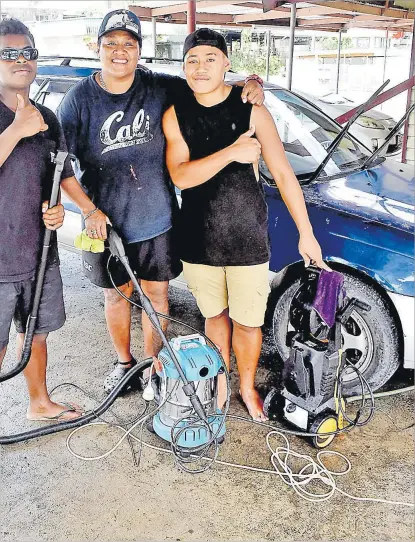  ?? Picture: ATU RASEA ?? Ivanancy Vunikura (centre) flanked by Siteri Rokotau (left) and Latu at her newly-opened car wash at Shalimar St,
Raiwasa in Suva.