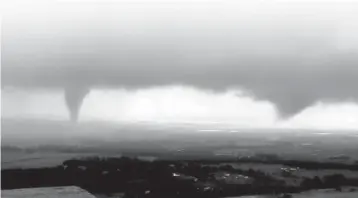  ?? KWTV-KOTV via AP ?? LEFT: This image made from video provided by KWTV-KOTV shows two funnel clouds Monday in Crescent, Okla.