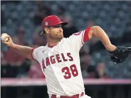  ?? MARK J. TERRILL — THE ASSOCIATED PRESS ?? Angels starter Alex Cobb held the Astros to one run and four hits in 5 / innings.