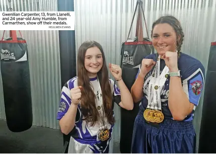  ?? HEULWEN EVANS ?? Gwenllian Carpenter, 13, from Llanelli, and 24 year-old Amy Humble, from Carmarthen, show off their medals.