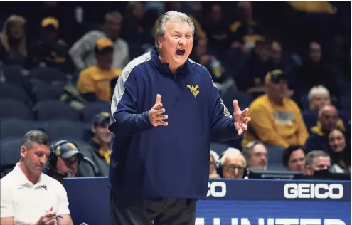  ?? Kathleen Batten / Associated Press ?? West Virginia coach Bob Huggins, who boasts 900 career wins, has fond memories of battles against UConn over the years. WVU hosts the Huskies on Wednesday night in a Big East-Big 12 Challenge game.