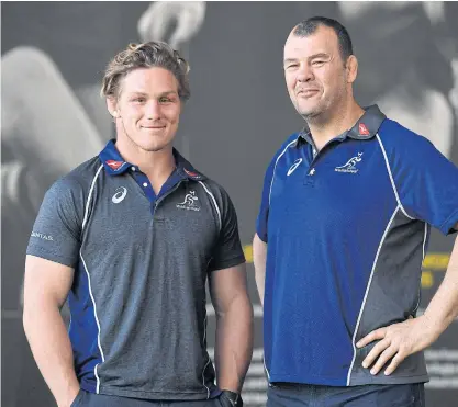  ??  ?? Australia’s Michael Hooper, left, poses with coach Michael Cheika after a press conference in Sydney.