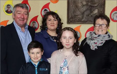  ??  ?? Róise Furlong (second from right) who made her Confirmati­on on Friday in Carrig-on-Bannow Church, pictured with Noel Hayes,Sean Furlong, Kerrie Furlong and Monica Hayes.