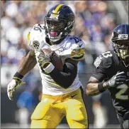 ?? TASOS KATOPODIS / GETTY IMAGES ?? Steelers running back Le’Veon Bell runs in front of Ravens safety Tony Jefferson during the first quarter of a 26-9 win in Baltimore.