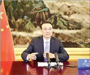  ?? XINHUA NEWS AGENCY ?? Chinese Premier Li Keqiang delivers a speech via video at the ASEAN Business and Investment Summit in Beijing on Friday.