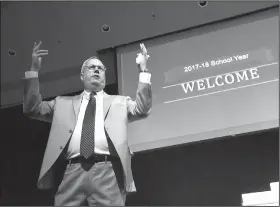  ?? NWA Democrat-Gazette/FLIP PUTTHOFF ?? Marlin Berry, superinten­dent of Rogers Public Schools, welcomes teachers during the Thank A Teacher Celebratio­n on Aug. 9 in the Rogers High School auditorium. Berry welcomed district teachers for the school year that starts Wednesday at most Rogers...